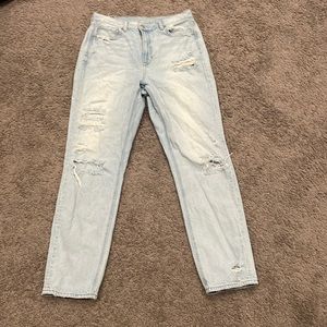 Light-washed ripped mom jeans